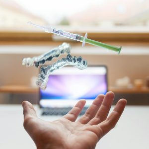 Syringe Floating Near Person's Hand